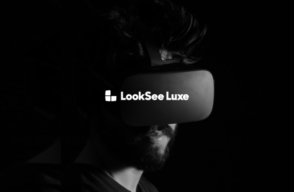 Person wearing a LookSee Luxe headset with logo visible